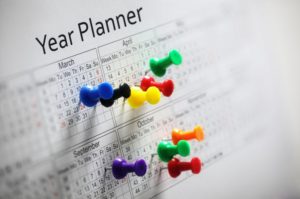 12 week Year planner with colorful thumbtacks